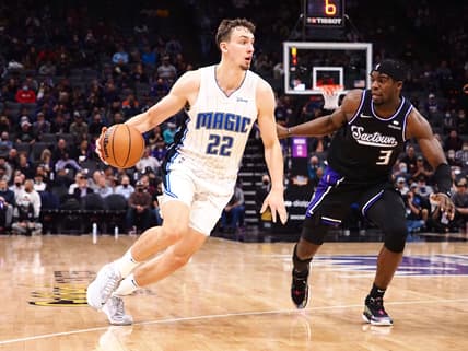 Dec 8, 2021; Sacramento, California, USA; Orlando Magic forward Franz Wagner (22) dribbles the ball against Sacramento Kings guard Terence Davis II (3) during the third quarter at Golden 1 Center. Mandatory Credit: Kelley L Cox-USA TODAY Sports