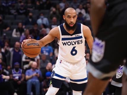 Feb 9, 2022; Sacramento, California, USA; Minnesota Timberwolves guard Jordan McLaughlin (6) controls the ball against the Sacramento Kings during the second quarter at Golden 1 Center. Mandatory Credit: Kelley L Cox-USA TODAY Sports