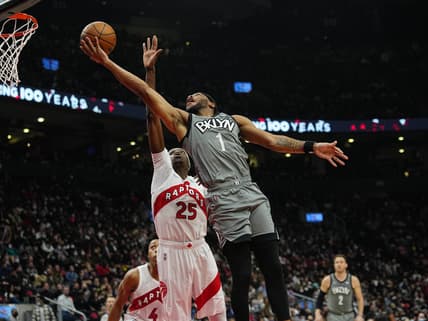 Mar 1, 2022; Toronto, Ontario, CAN; Brooklyn Nets forward Bruce Brown (1) goes up to make a basket against Toronto Raptors forward Chris Boucher (25) during the first half at Scotiabank Arena. Mandatory Credit: John E. Sokolowski-USA TODAY Sports