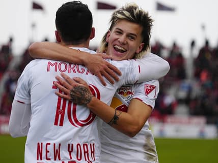 Mar 5, 2022; Toronto, Ontario, CAN; New York Red Bulls defender John Tolkin (47) congratulates midfielder Lewis Morgan (10) on his second goal of the first half against Toronto FC at BMO Field. Mandatory Credit: John E. Sokolowski-USA TODAY Sports