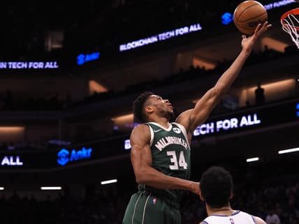Mar 16, 2022; Sacramento, California, USA; Milwaukee Bucks forward Giannis Antetokounmpo (34) scores a layup against the Sacramento Kings during the fourth quarter at Golden 1 Center. Mandatory Credit: Kelley L Cox-USA TODAY Sports