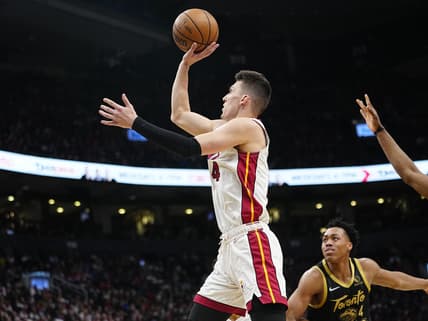 Apr 3, 2022; Toronto, Ontario, CAN; Miami Heat guard Tyler Herro (14) goes up to make a basket against the Toronto Raptors during the first half at Scotiabank Arena. Mandatory Credit: John E. Sokolowski-USA TODAY Sports