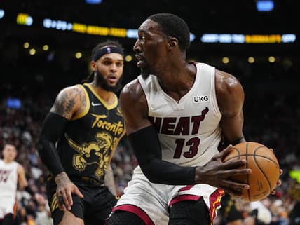 Apr 3, 2022; Toronto, Ontario, CAN; Miami Heat center Bam Adebayo (13) looks to pass the ball as Toronto Raptors guard Gary Trent Jr. (33) defends during the first half at Scotiabank Arena. Mandatory Credit: John E. Sokolowski-USA TODAY Sports
