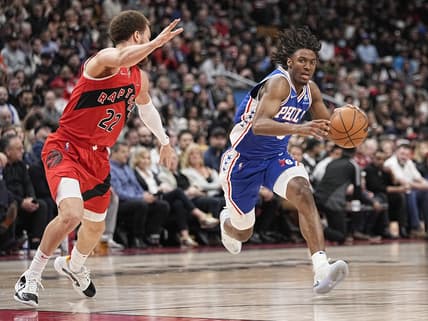 Apr 7, 2022; Toronto, Ontario, CAN; Philadelphia 76ers guard Tyrese Maxey (0) dribbles the ball against Toronto Raptors guard Malachi Flynn (22) during the first half at Scotiabank Arena. Mandatory Credit: John E. Sokolowski-USA TODAY Sports