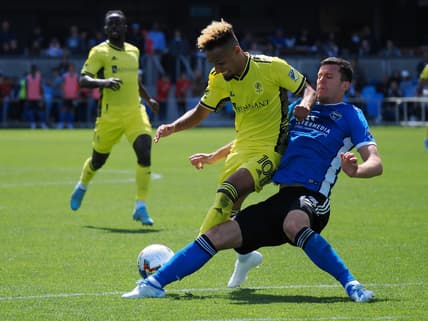 Apr 16, 2022; San Jose, California, USA; San Jose Earthquakes defender Nathan Raphael Pelae Cardoso (13) slide tackles Nashville SC midfielder Hany Mukhtar (10) during the second half at PayPal Park Stadium. Mandatory Credit: Kelley L Cox-USA TODAY Sports
