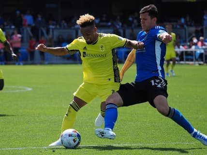 Apr 16, 2022; San Jose, California, USA; San Jose Earthquakes defender Nathan Raphael Pelae Cardoso (13) slide tackles Nashville SC midfielder Hany Mukhtar (10) during the second half at PayPal Park Stadium. Mandatory Credit: Kelley L Cox-USA TODAY Sports