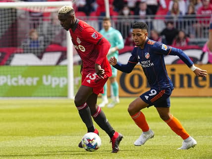 Apr 30, 2022; Toronto, Ontario, CAN; Toronto FC defender Chris Mavinga (23) controls the ball against FC Cincinnati forward Brenner (9) during the first half at BMO Field. Mandatory Credit: John E. Sokolowski-USA TODAY Sports