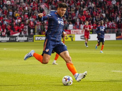 Apr 30, 2022; Toronto, Ontario, CAN; FC Cincinnati forward Brandon Vazquez (19) goes to kick the ball against Toronto FC during the second half at BMO Field. Mandatory Credit: John E. Sokolowski-USA TODAY Sports