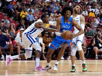 Jul 15, 2022; Las Vegas, NV, USA; Oklahoma City Thunder forward Jaylin Williams (6) drives between Golden State Warriors forward Jonathan Kuminga (0) and Golden State Warriors guard Quinndary Weatherspoon (12) during an NBA Summer League game at Thomas & Mack Center. Mandatory Credit: Stephen R. Sylvanie-USA TODAY Sports