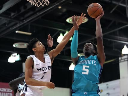 Jul 16, 2022; Las Vegas, NV, USA; Charlotte Hornets center Mark Williams (5) shoots against Minnesota Timberwolves forward Josh Minott (7) during an NBA Summer League game at Cox Pavillion. Mandatory Credit: Stephen R. Sylvanie-USA TODAY Sports