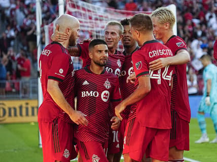 Jul 23, 2022; Toronto, Ontario, CAN; Toronto FC midfielder Michael Bradley (left) gets congratulated after scoring on Charlotte FC by Toronto FC attacker Lorenzo Insigne (24) and midfielder Federico Bernardeschi (10) and defender Domenico Criscito (44) and defender Lukas MacNaughton (5) at BMO Field. Mandatory Credit: John E. Sokolowski-USA TODAY Sports