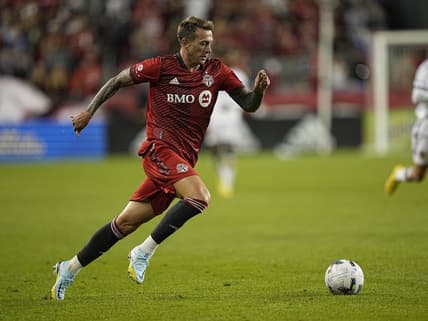 Aug 31, 2022; Toronto, Ontario, CAN; Toronto FC forward Frederico Bernardeschi (10) dribbles the ball against the LA Galaxy during the second half at BMO Field. Mandatory Credit: John E. Sokolowski-USA TODAY Sports
