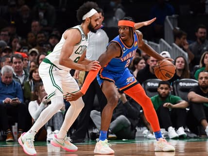 Nov 14, 2022; Boston, Massachusetts, USA; Oklahoma City Thunder guard Shai Gilgeous-Alexander (2) dribbles the ball against Boston Celtics guard Derrick White (9) during the first half at the TD Garden. Mandatory Credit: Brian Fluharty-USA TODAY Sports