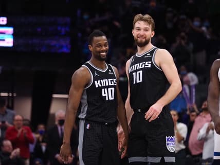 Feb 9, 2022; Sacramento, California, USA; Sacramento Kings forward Harrison Barnes (40) and center Domantas Sabonis (10) smiles in the final seconds of the game against the Minnesota Timberwolves during the fourth quarter at Golden 1 Center. Mandatory Credit: Kelley L Cox-USA TODAY Sports