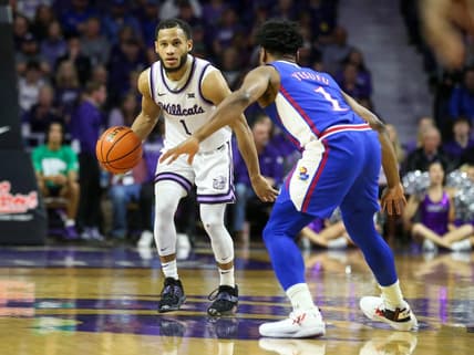 Jan 17, 2023; Manhattan, Kansas, USA; Kansas State Wildcats guard Markquis Nowell (1) brings the ball up court against Kansas Jayhawks guard Joseph Yesufu (1) during the first half at Bramlage Coliseum. Mandatory Credit: Scott Sewell-USA TODAY Sports