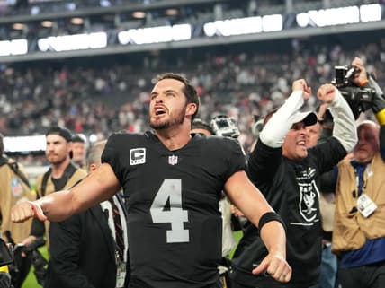 Dec 18, 2022; Paradise, Nevada, USA; Las Vegas Raiders quarterback Derek Carr (4) and Raiders head coach Josh McDaniels celebrate after the Raiders defeated the New England Patriots 30-24 at Allegiant Stadium. Mandatory Credit: Stephen R. Sylvanie-USA TODAY Sports