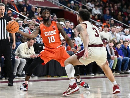 Feb 4, 2023; Chestnut Hill, Massachusetts, USA; Syracuse Orange guard Symir Torrence (10) passes the ball around Boston College Eagles guard Jaeden Zackery (3) during the first half at the Conte Forum. Mandatory Credit: Brian Fluharty-USA TODAY Sports