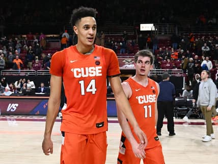 Feb 4, 2023; Chestnut Hill, Massachusetts, USA; Syracuse Orange center Jesse Edwards (14) walks off of the court with guard Joseph Girard III (11) after a game against the Boston College Eagles at the Conte Forum. Mandatory Credit: Brian Fluharty-USA TODAY Sports
