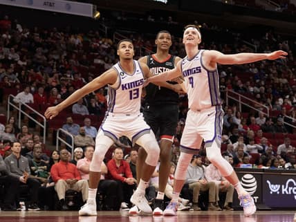 Feb 6, 2023; Houston, Texas, USA; Sacramento Kings forward Keegan Murray (13) and Sacramento Kings guard Kevin Huerter (9) block out Houston Rockets forward Jabari Smith Jr. (1) in the second quarter at Toyota Center. Mandatory Credit: Thomas Shea-USA TODAY Sports