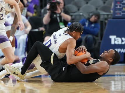 Mar 8, 2023; Las Vegas, NV, USA; Washington Huskies guard Koren Johnson (0) battles Colorado Buffaloes guard Jalen Gabbidon (3) for control of the ball during the first half at T-Mobile Arena. Mandatory Credit: Stephen R. Sylvanie-USA TODAY Sports