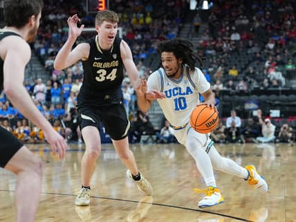 Mar 9, 2023; Las Vegas, NV, USA; UCLA Bruins guard Tyger Campbell (10) dribbles against Colorado Buffaloes center Lawson Lovering (34) during the first half at T-Mobile Arena. Mandatory Credit: Stephen R. Sylvanie-USA TODAY Sports