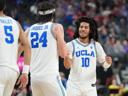 Mar 10, 2023; Las Vegas, NV, USA; UCLA Bruins guard Tyger Campbell (10) celebrates with UCLA Bruins guard Jaime Jaquez Jr. (24) after a scoring play against the Oregon Ducks during the second half at T-Mobile Arena. Mandatory Credit: Stephen R. Sylvanie-USA TODAY Sports