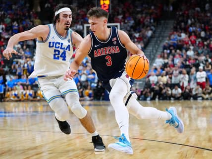Mar 11, 2023; Las Vegas, NV, USA; Arizona Wildcats guard Pelle Larsson (3) dribbles against UCLA Bruins guard Jaime Jaquez Jr. (24) during the second half at T-Mobile Arena. Mandatory Credit: Stephen R. Sylvanie-USA TODAY Sports