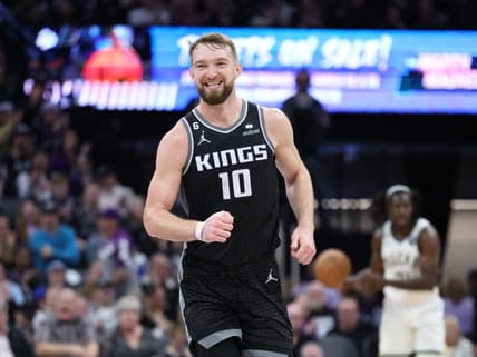 Mar 13, 2023; Sacramento, California, USA; Sacramento Kings power forward Domantas Sabonis (10) smiles after a play against the Milwaukee Bucks during the third quarter at Golden 1 Center. Mandatory Credit: Kelley L Cox-USA TODAY Sports
