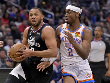 Mar 23, 2023; Los Angeles, California, USA;  Los Angeles Clippers guard Eric Gordon (10) has the ball stropped by Oklahoma City Thunder guard Shai Gilgeous-Alexander (2) as he moves to the basket in the first half at Crypto.com Arena. Mandatory Credit: Jayne Kamin-Oncea-USA TODAY Sports
