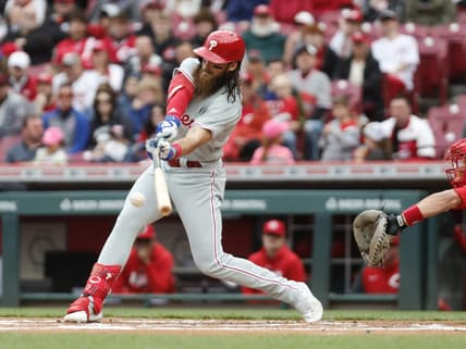 Apr 16, 2023; Cincinnati, Ohio, USA; Philadelphia Phillies center fielder Brandon Marsh hits a two-run single against the Cincinnati Reds during the first inning at Great American Ball Park. Mandatory Credit: David Kohl-USA TODAY Sports