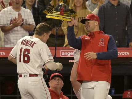 May 22, 2023; Anaheim, California, USA;  Los Angeles Angels center fielder Mickey Moniak (16) is greeted at the dugout after hitting a solo home run in the eighth inning against the Boston Red Sox at Angel Stadium. Mandatory Credit: Jayne Kamin-Oncea-USA TODAY Sports