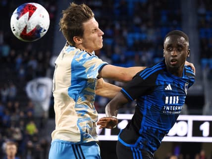Jun 10, 2023; San Jose, California, USA; San Jose Earthquakes midfielder Jamiro Monteiro (35) heads the ball against Philadelphia Union defender Jack Elliott (3) during the first half at PayPal Park. Mandatory Credit: Kelley L Cox-USA TODAY Sports