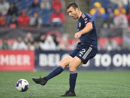 Jun 17, 2023; Foxborough, Massachusetts, USA; New England Revolution defender Dave Romney (2) kicks the ball during the first half of a match against Orlando City at Gillette Stadium. Mandatory Credit: Brian Fluharty-USA TODAY Sports