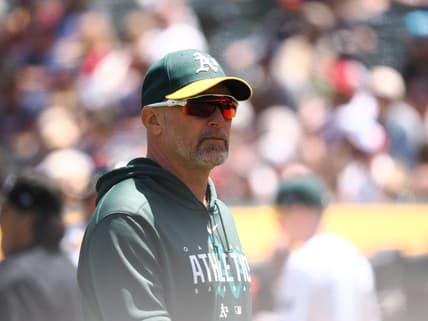 May 31, 2023; Oakland, California, USA; Oakland Athletics manager Mark Kotsay (7) returns to the dugout after replacing the pitcher against the Atlanta Braves during the fifth inning at Oakland-Alameda County Coliseum. Mandatory Credit: Kelley L Cox-USA TODAY Sports