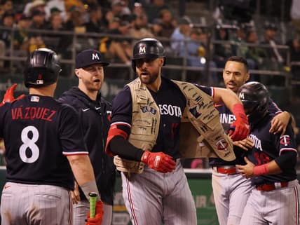 Jul 14, 2023; Oakland, California, USA; Minnesota Twins  left fielder Joey Gallo (13) celebrates with teammates after hitting a two-run home run Oakland Athletics during the ninth inning at Oakland-Alameda County Coliseum. Mandatory Credit: Kelley L Cox-USA TODAY Sports