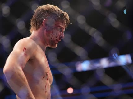 Dec 10, 2022; Las Vegas, Nevada, USA; Bryce Mitchell (red gloves) reacts after the fight against Ilia Topuria (blue gloves) during UFC 282 at T-Mobile Arena. Mandatory Credit: Stephen R. Sylvanie-USA TODAY Sports