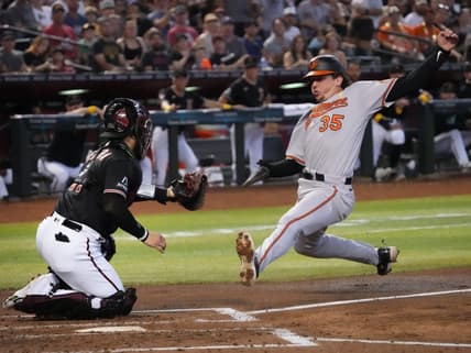 Sep 3, 2023; Phoenix, AZ, USA; Arizona Diamondbacks catcher Jose Herrera (11) tags out Baltimore Orioles' Adley Rutschman (35) at Chase Field.