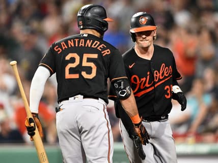 Sep 8, 2023; Boston, Massachusetts, USA; Baltimore Orioles catcher Adley Rutschman (35) high-fives right fielder Anthony Santander (25) after hitting a home run against the Boston Red Sox during the eighth inning at Fenway Park. Mandatory Credit: Brian Fluharty-USA TODAY Sports