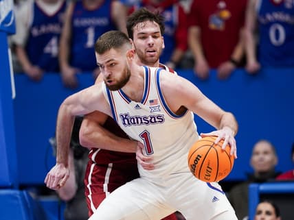Jan 13, 2024; Lawrence, Kansas, USA; Kansas Jayhawks center Hunter Dickinson (1) drives against Oklahoma Sooners forward Sam Godwin (10) during the first half at Allen Fieldhouse. Mandatory Credit: Jay Biggerstaff-USA TODAY Sports
