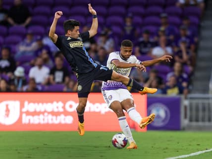Jun 21, 2023; Orlando, Florida, USA;  Orlando City SC defender Rafael Santos (3) passes the ball past Philadelphia Union midfielder Joaquin Torres (19) in the first half at Exploria Stadium. Mandatory Credit: Nathan Ray Seebeck-USA TODAY Sports
