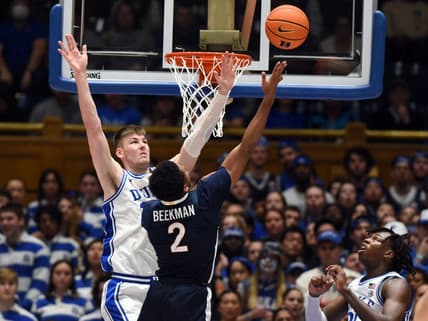 Mar 2, 2024; Durham, North Carolina, USA; Virginia Cavaliers guard Reece Beekman (2) shoots over Duke Blue Devils center Kyle Filipowski (30) during the second half at Cameron Indoor Stadium. Mandatory Credit: Rob Kinnan-USA TODAY Sports