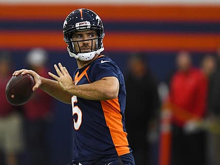 Joe Flacco throwing a pass as a member of the Denver Broncos