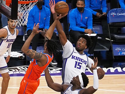 May 9, 2021; Sacramento, California, USA; Sacramento Kings center Damian Jones (15) blocks the shot by Oklahoma City Thunder forward Josh Hall (15) during the first quarter at Golden 1 Center. Mandatory Credit: Kelley L Cox-USA TODAY Sports