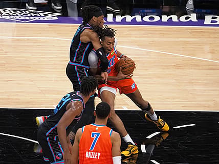 May 11, 2021; Sacramento, California, USA; Oklahoma City Thunder center Moses Brown (9) drives in against Sacramento Kings forward Richaun Holmes (22) during the first quarter at Golden 1 Center. Mandatory Credit: Kelley L Cox-USA TODAY Sports