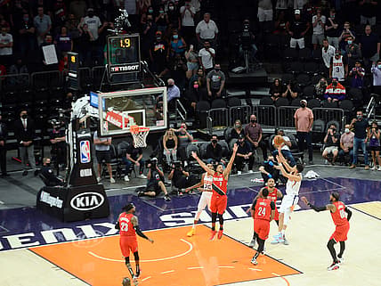 May 13, 2021; Phoenix, Arizona, USA; Phoenix Suns guard Devin Booker (1) is fouled as he attempts shot against the Portland Trail Blazers during the second half at Phoenix Suns Arena. Mandatory Credit: Joe Camporeale-USA TODAY Sports