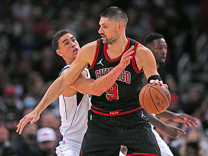 Nov 10, 2021; Chicago, Illinois, USA; Chicago Bulls center Nikola Vucevic (9) is defended by Dallas Mavericks center Dwight Powell (7) during the second half at the United Center. Mandatory Credit: Dennis Wierzbicki-USA TODAY Sports