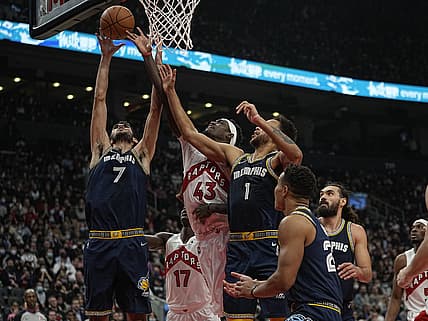 Nov 30, 2021; Toronto, Ontario, CAN; Memphis Grizzlies forward Santi Aldama (7) and Toronto Raptors forward Pascal Siakam (43) and Memphis Grizzlies forward Kyle Anderson (1) battle for a rebound during the first half at Scotiabank Arena. Mandatory Credit: John E. Sokolowski-USA TODAY Sports