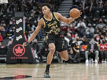 Dec 18, 2021; Toronto, Ontario, CAN; Toronto Raptors forward Scottie Barnes (4) controls the ball against the Golden State Warriors during the second half at Scotiabank Arena. Mandatory Credit: John E. Sokolowski-USA TODAY Sports