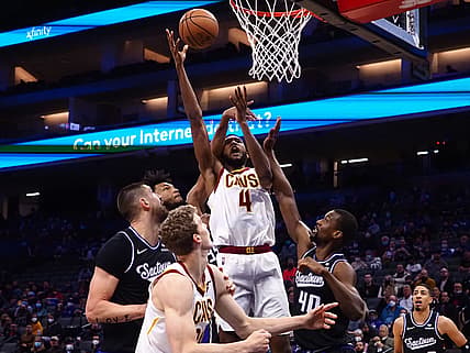 Jan 10, 2022; Sacramento, California, USA; Cleveland Cavaliers forward-center Evan Mobley (4) shoots the ball between Sacramento Kings forward Marvin Bagley III (35), center Alex Len (25) and forward Harrison Barnes (40) during the first quarter at Golden 1 Center. Mandatory Credit: Kelley L Cox-USA TODAY Sports