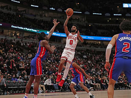 Jan 11, 2022; Chicago, Illinois, USA; Chicago Bulls guard Coby White (0) shoots over Detroit Pistons center Isaiah Stewart (28) during the first half at the United Center. Mandatory Credit: Dennis Wierzbicki-USA TODAY Sports
